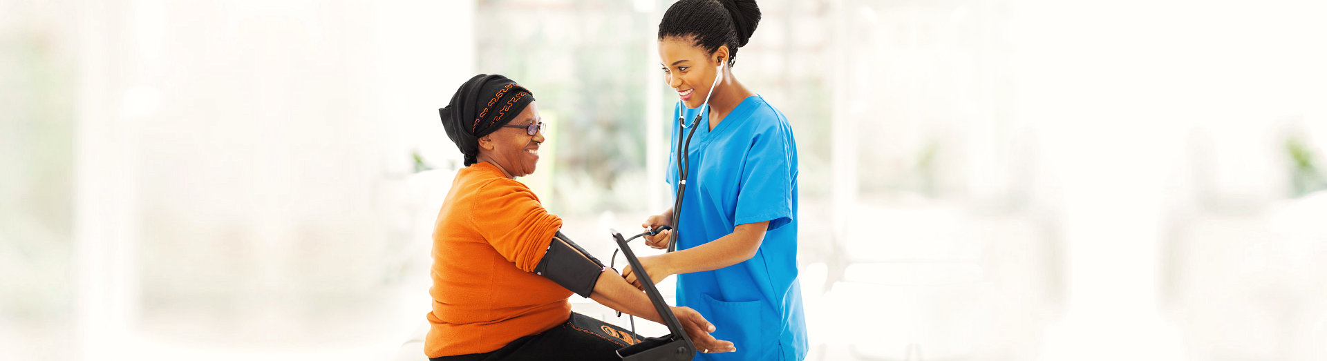 nurse checking blood pressure