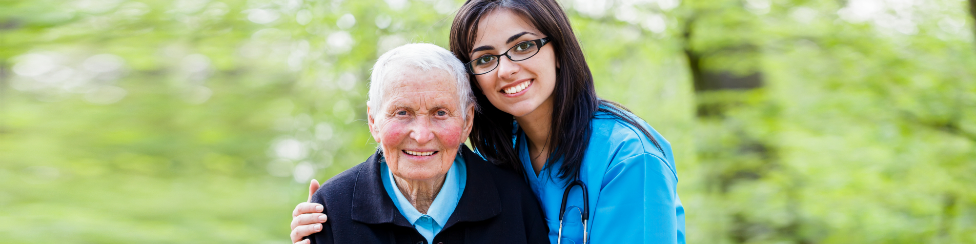 nurse hugging senior man